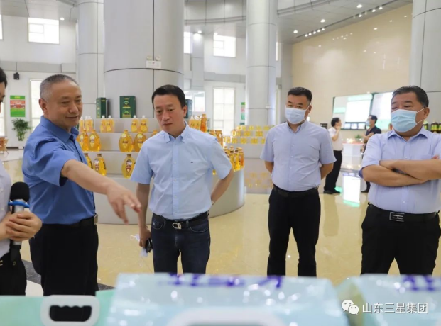 黑龙江省齐齐哈尔市粮食局党组书记、局长周建宇来山东三星集团参观调研